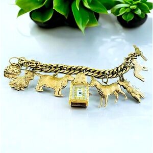 Kirk's Folly: retired, vintage,rare Dogs on parade gold tone charms bracelet